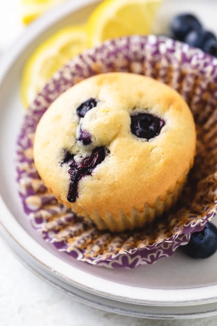 Close up view of the top of a gluten free lemon blueberry muffin.