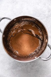 Flour, cocoa powder, and salt sifted into a pan.