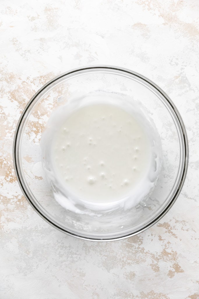 Sweet vanilla glaze in a bowl.