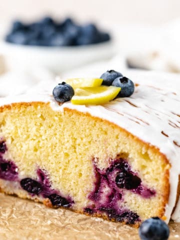 Side view of a loaf of blueberry bread.