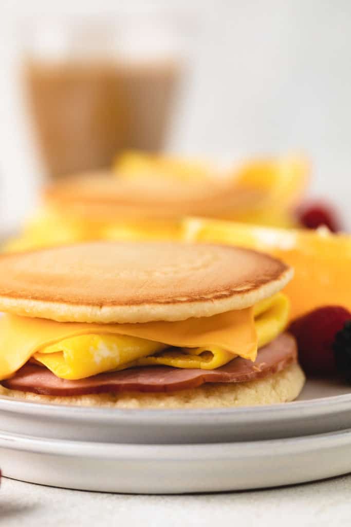 Close up view of a breakfast sandwich on a plate.