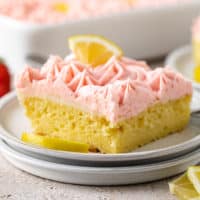 Close up view of strawberry lemonade cake on two plates.