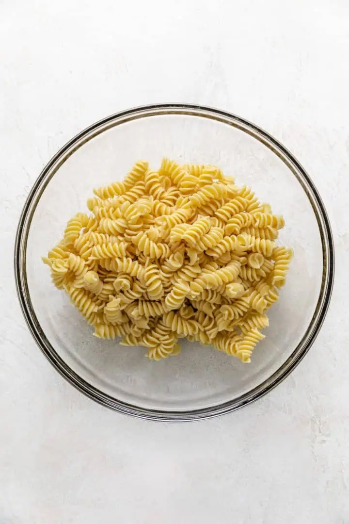 Pasta noodles in a mixing bowl.