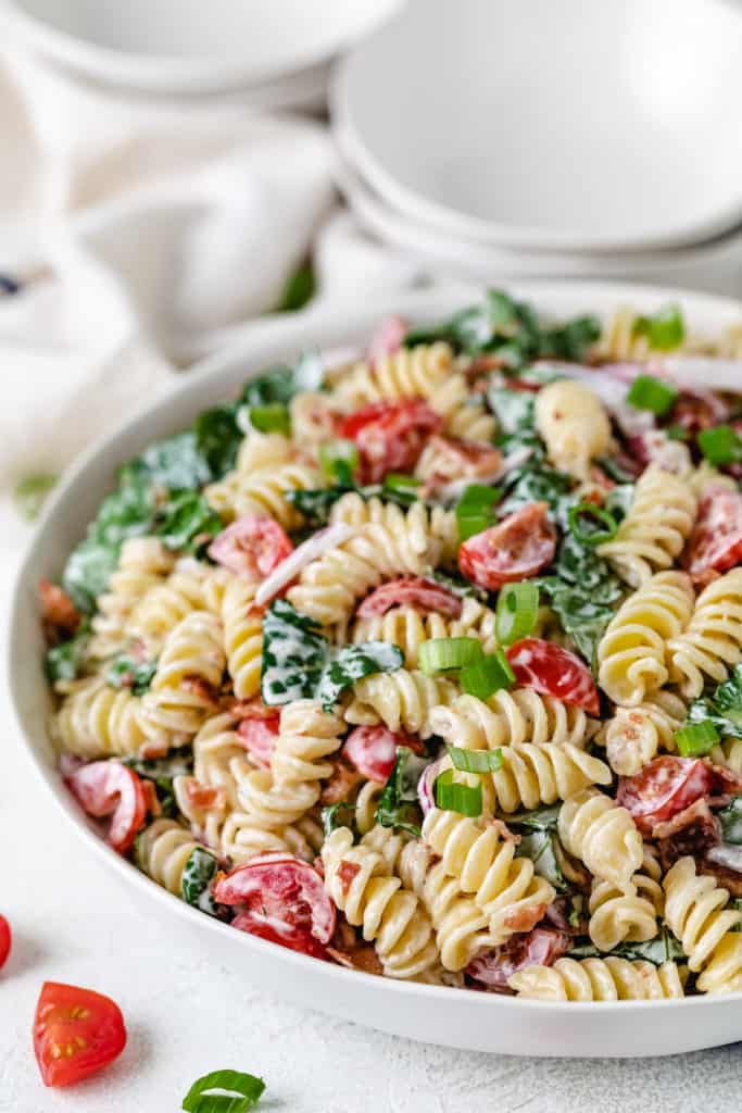 Green onions on top of pasta salad.