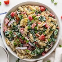 Top down view of a mixing bowl filled with blt pasta salad.