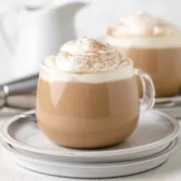 Close up view of coffee with whipped cream.