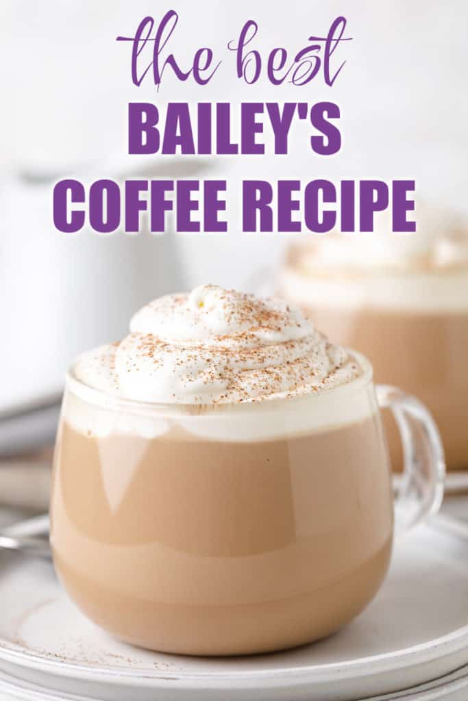 Glass coffee mug filled with Bailey's, milk and coffee.