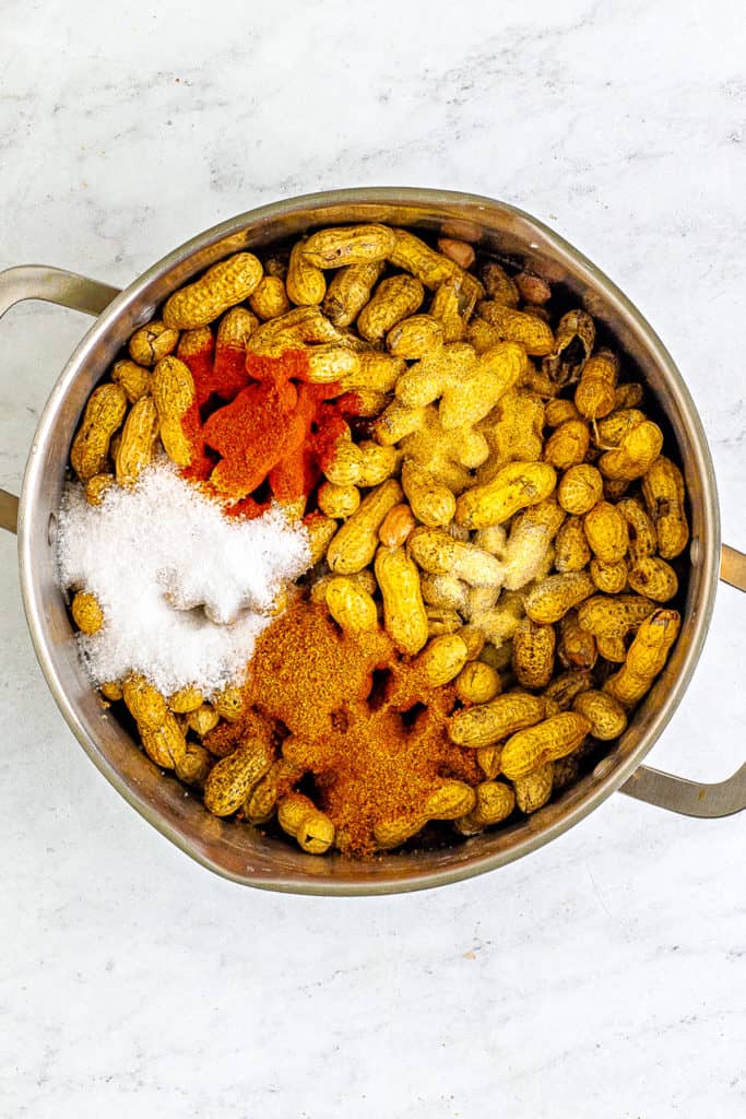 Seasonings and peanuts in a pan.