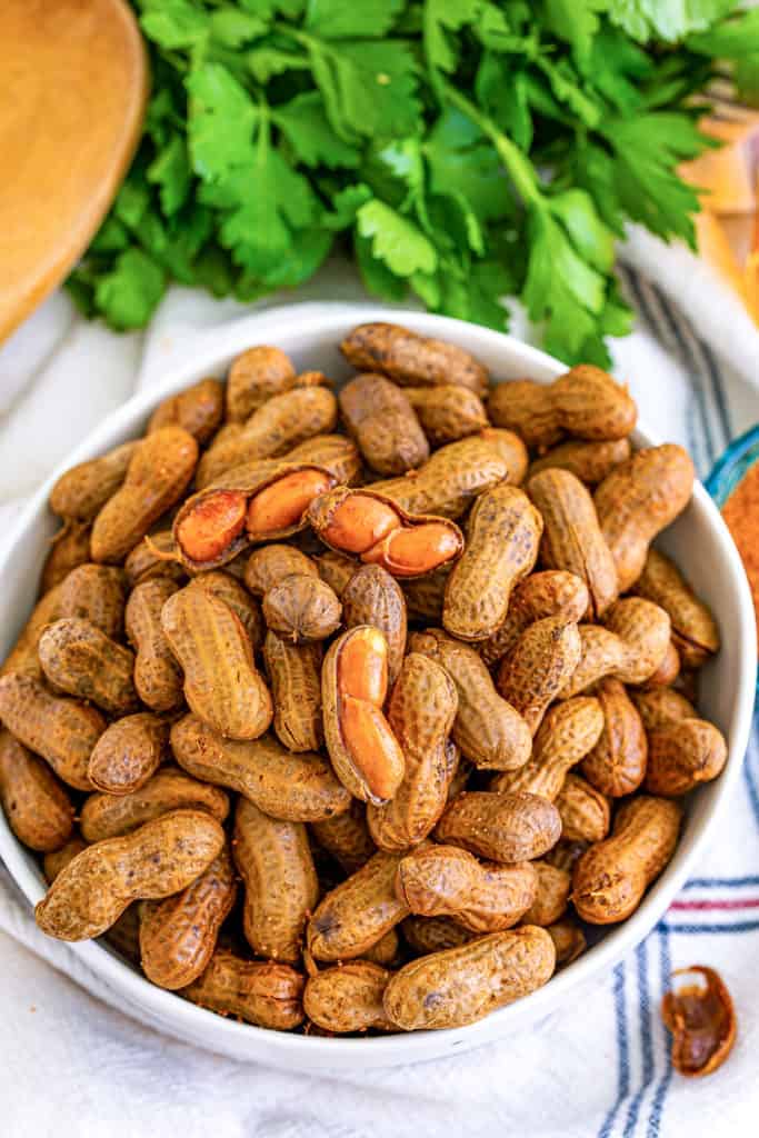 Top down view of a bowl of cajun peanuts.