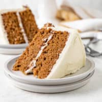 Slices of cake with cream cheese frosting.