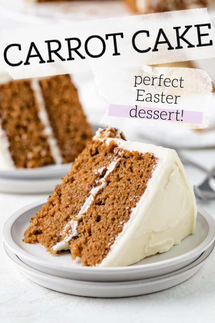 Slice of carrot cake with cream cheese frosting on a plate.