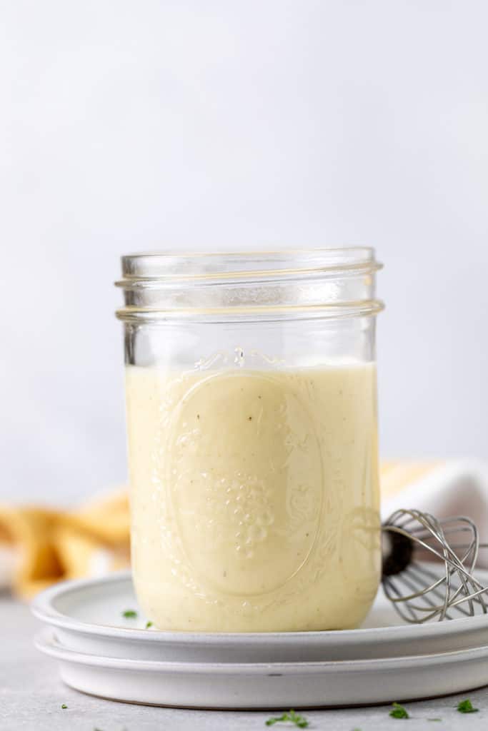 Mason jar filled with southern coleslaw dressing.