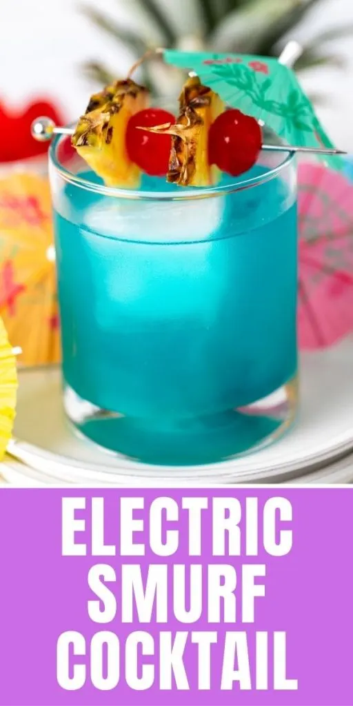 Blue cocktail on a stack of plates.