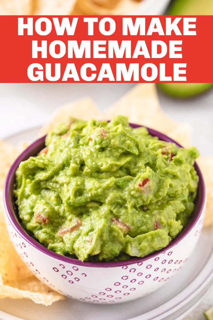 Guacamole dip in a purple and white dish.