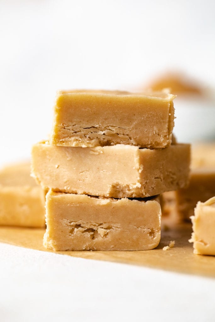 Stack of three pieces of peanut butter fudge.