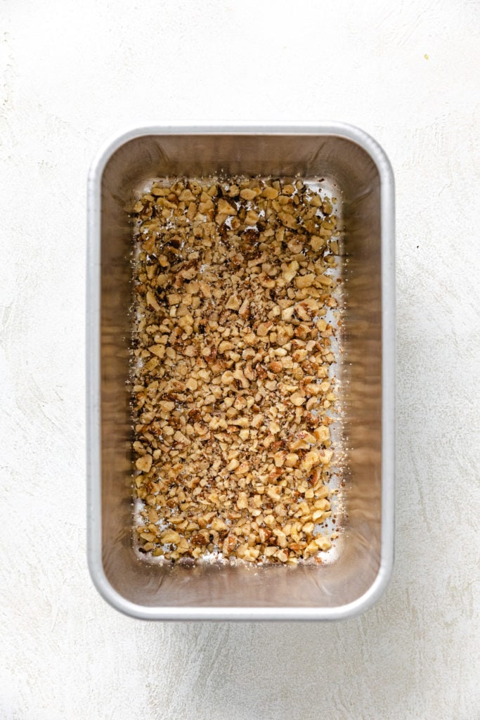 Nuts in the bottom of a loaf pan.