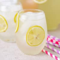 Close up view of tequila lemonade with lemon.