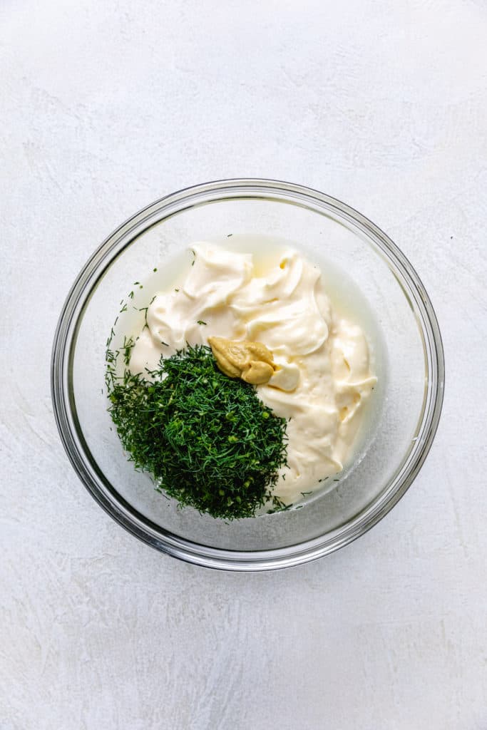 Ingredients for dill sauce in a mixing bowl.