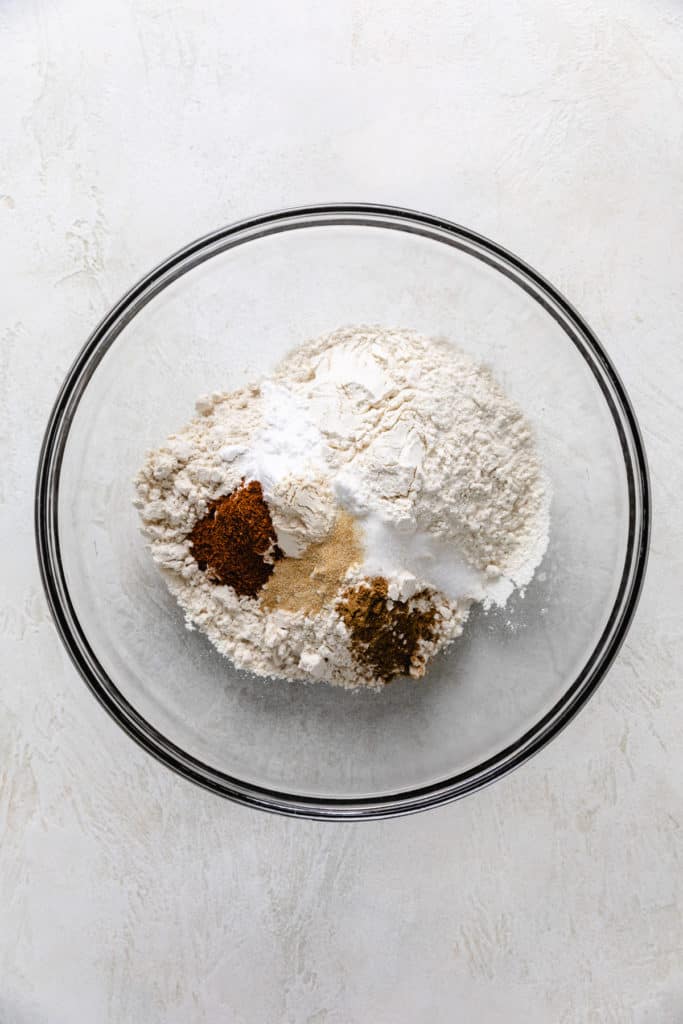 Masa harina, flour, baking powder, baking soda, and seasonings in a bowl.