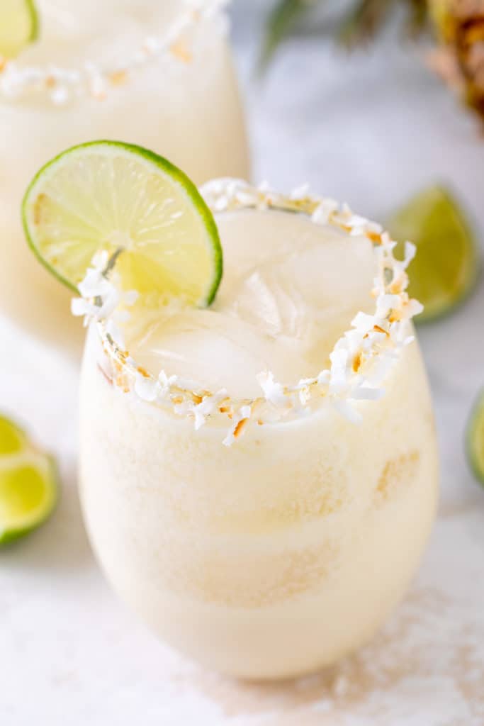 Lime and coconut garnish on a margarita.
