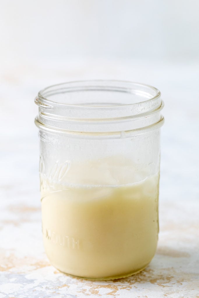 Shaken pineapple coconut margarita in a jar.