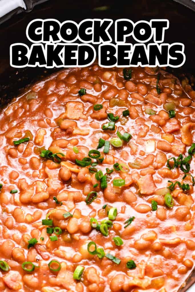 Close up view of a slow cooker filled with hot baked beans.