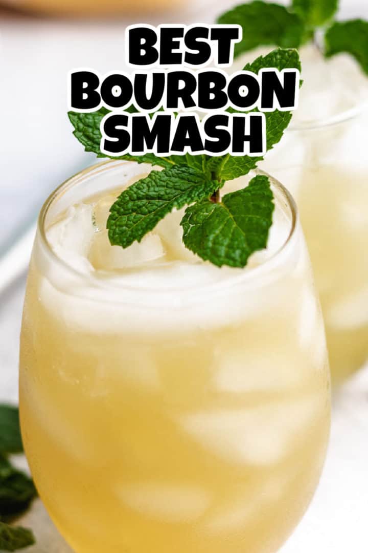 Close up view of a bourbon smash with mint.