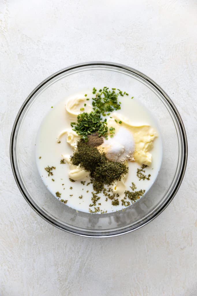 Ingredients for ranch salad dressing in a bowl.