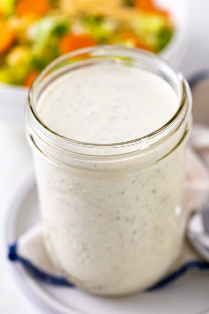 Top down view of a jar of salad dressing.