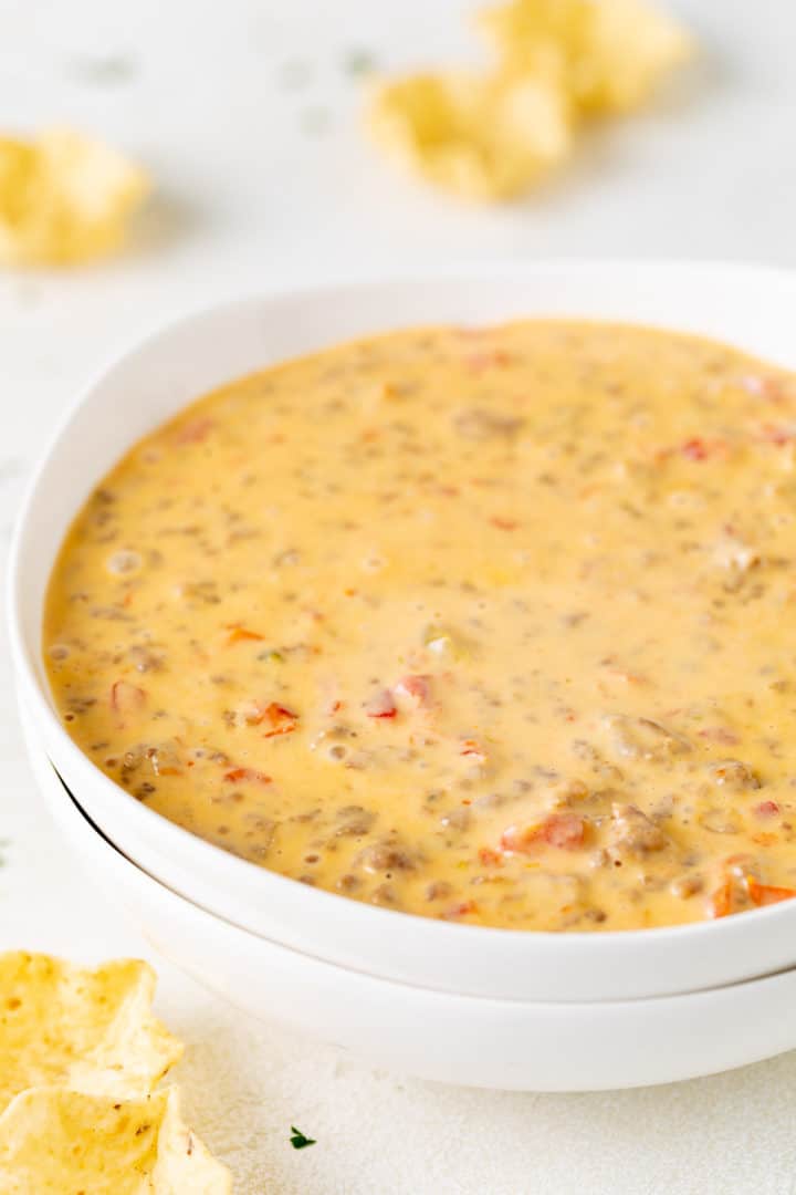 Close up view of a bowl of cheese dip.