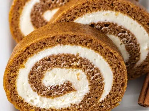 Close up view of a sliced pumpkin roll.