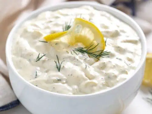 Serving bowl filled with a seafood condiment.