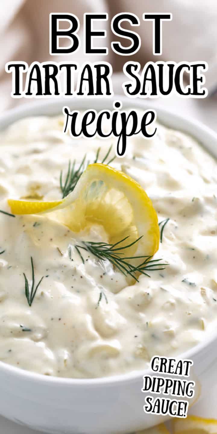 Bowl of dipping sauce with lemon and dill.