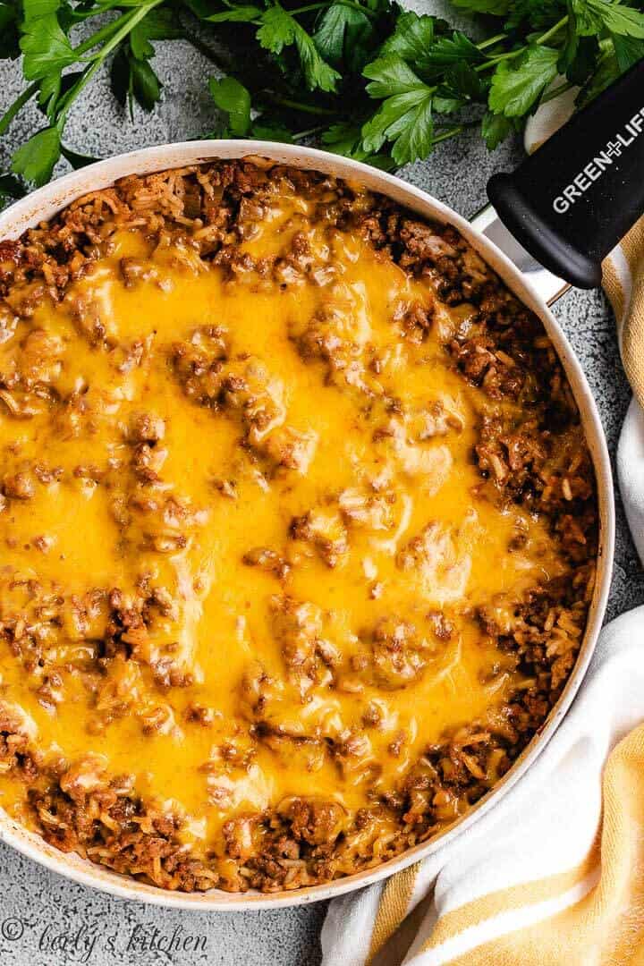 Melted cheddar cheese on a beef casserole.