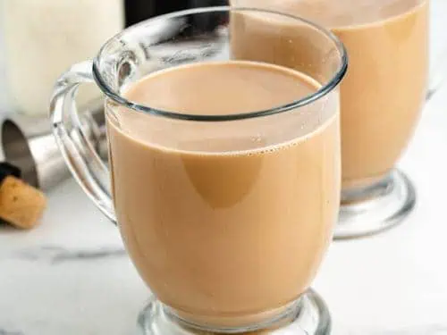 Close up view of a coffee cocktail in a glass mug.