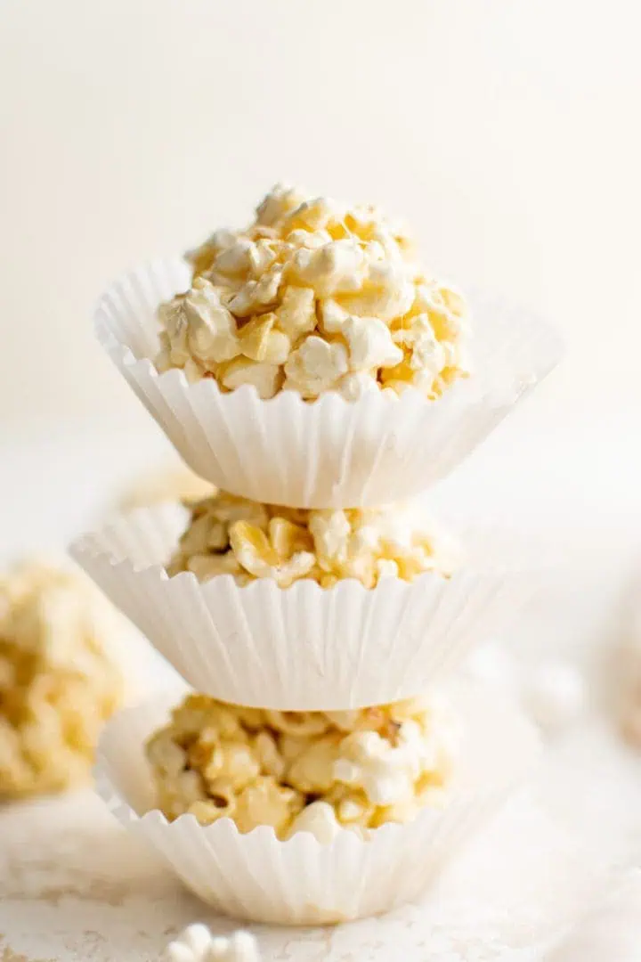 Stack of popcorn marshmallow balls in cups.
