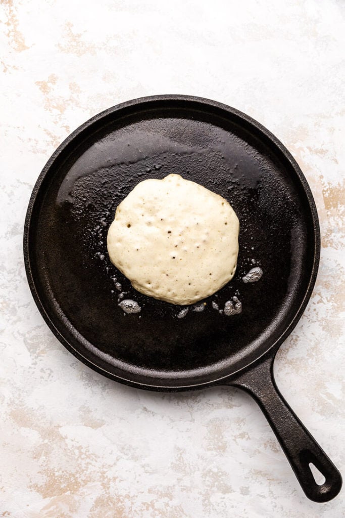 Pancake cooking on cast iron.