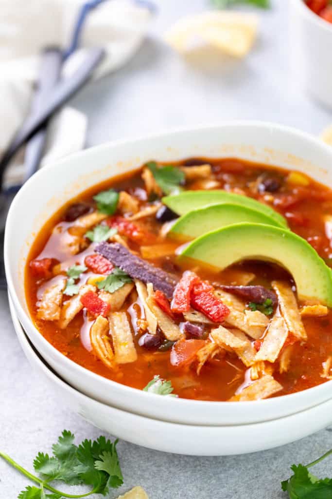 Chicken tortilla soup in two bowls.