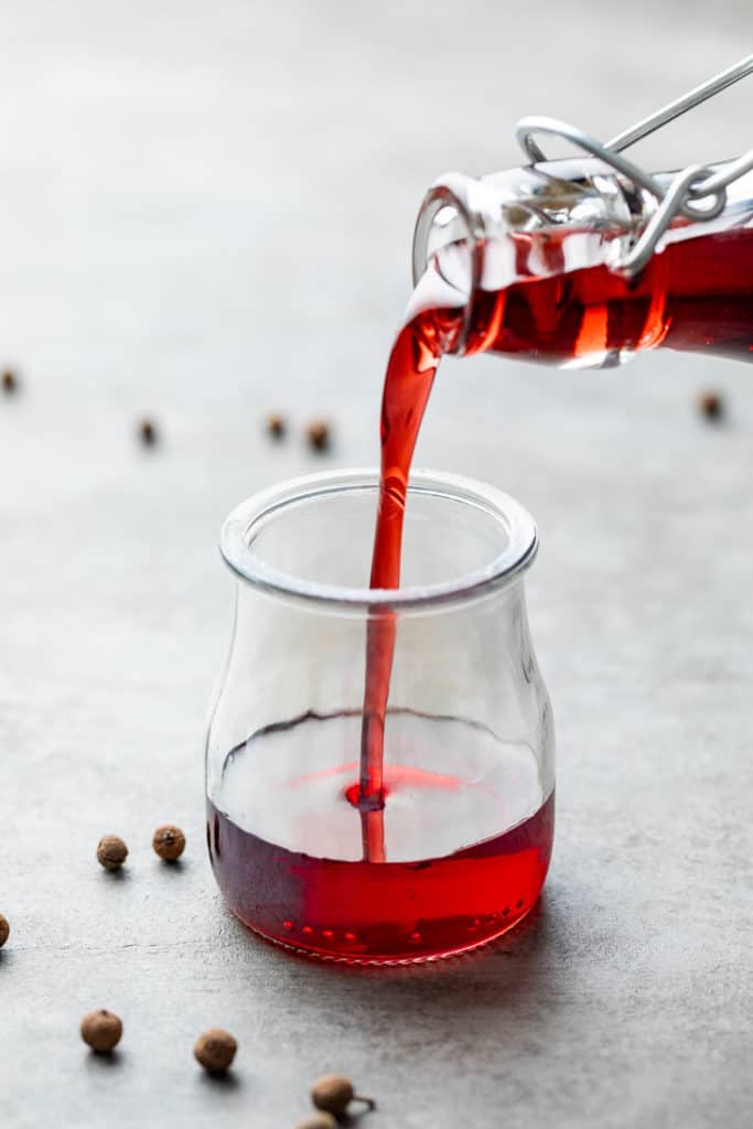 Grenadine being poured into a small container.