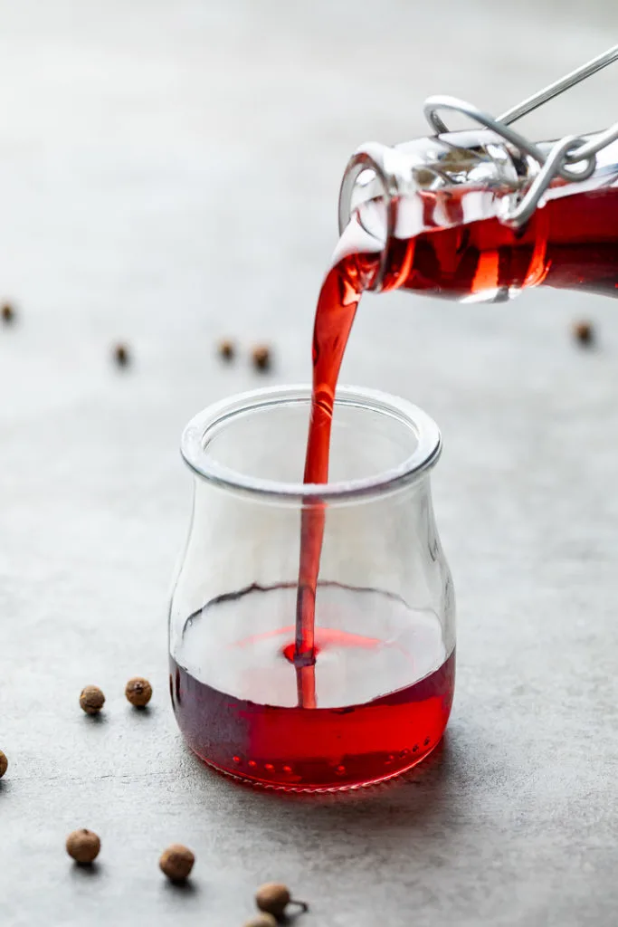Grenadine being poured into a small container.