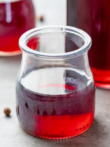 Jars filled with fruity simple syrup.