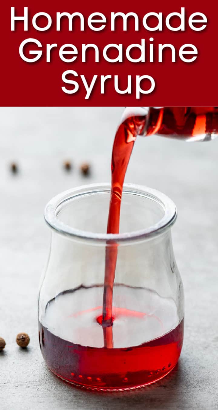 Homemade grenadine syrup being poured into a small jar.