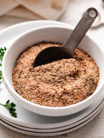 Spoon in a bowl of seasoning.
