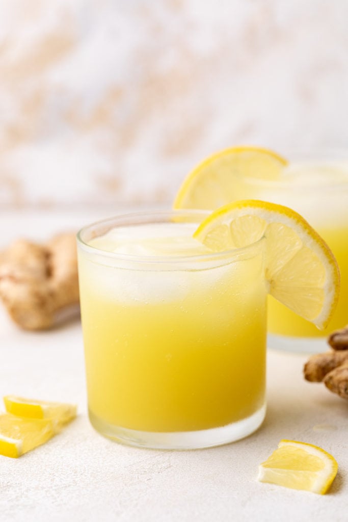 Lemon slices on a glass of ginger ale.