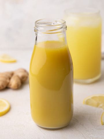 Ginger syrup in a tall jar.