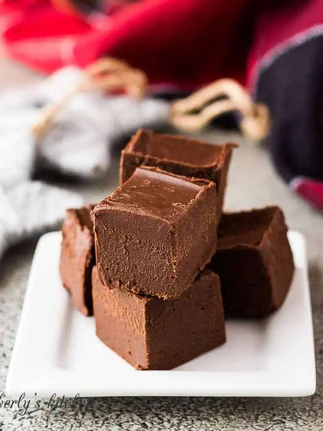 Stack of Irish cream fudge on a white plate.