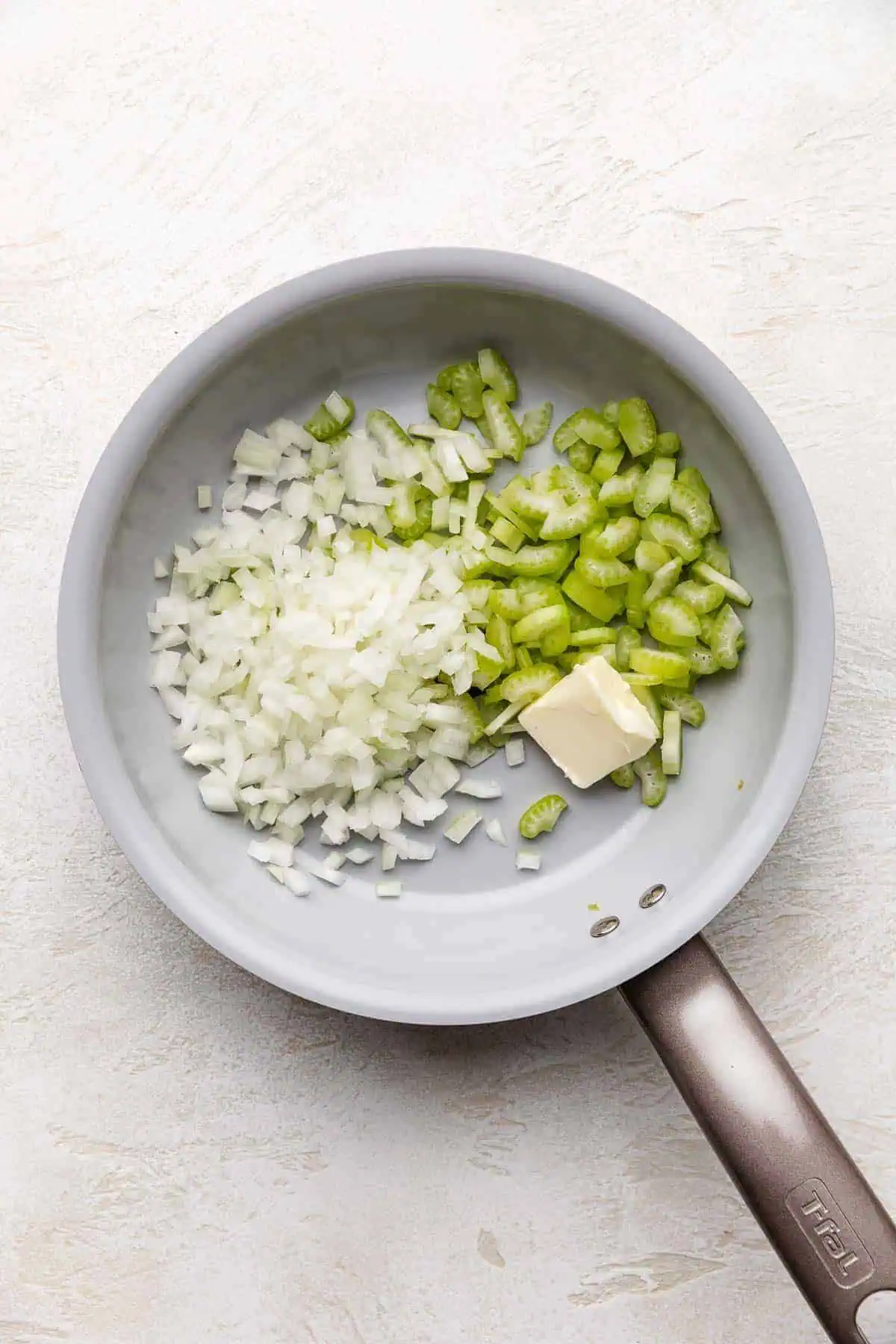Butter, celery and onions in a skillet.