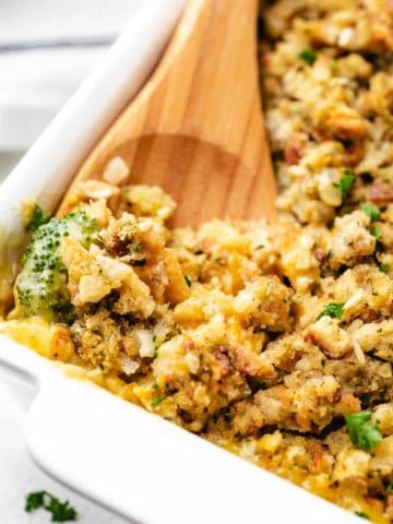 White pan filled with chicken and broccoli stuffing casserole.