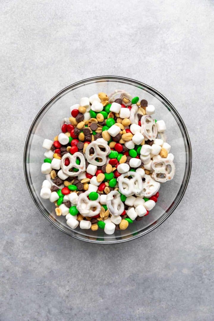 Christmas Trail Mix (Sweet &Amp; Salty Holiday Snack Mix) Top down view of snack mix in a glass bowl.