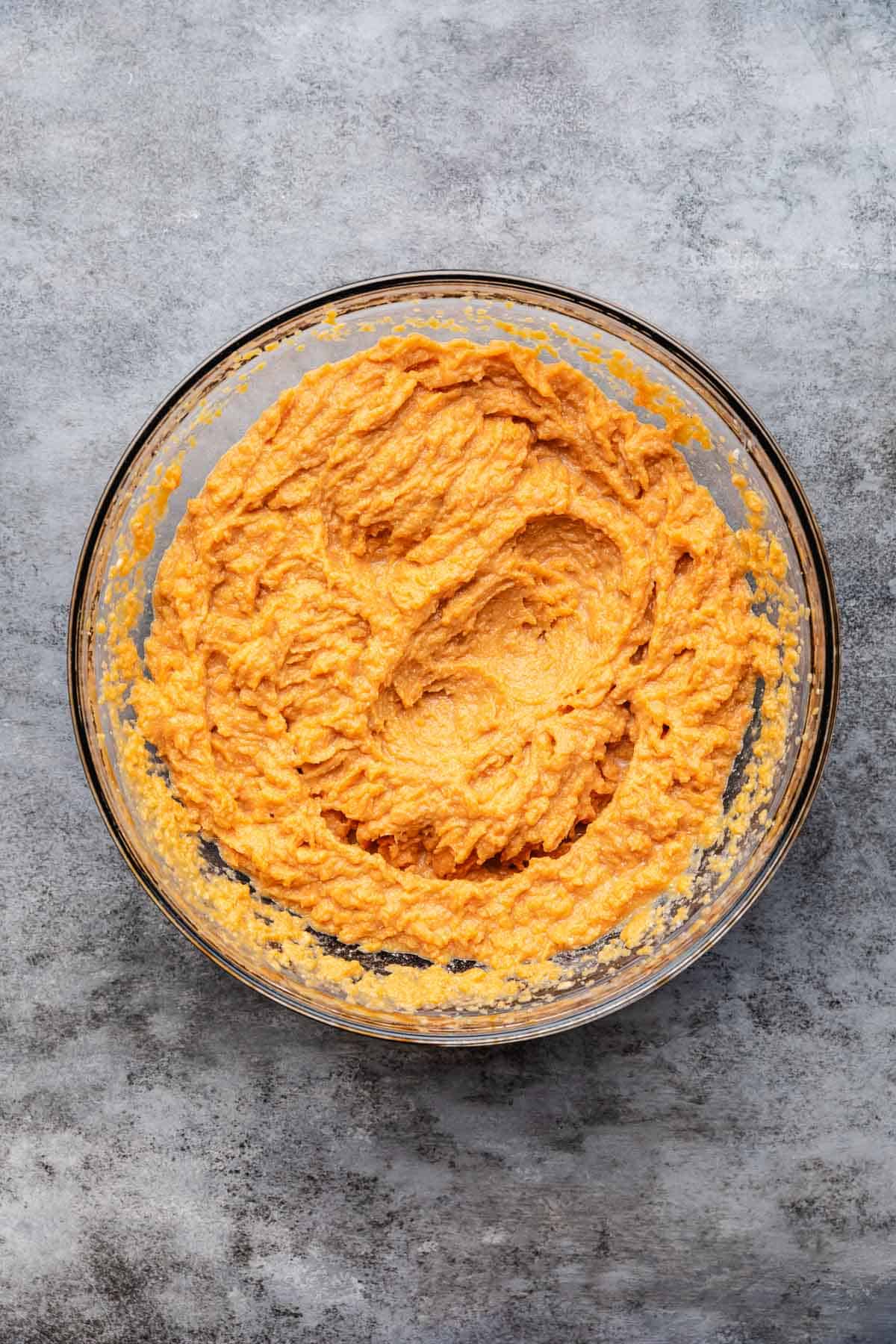 Seasoned canned yams in a bowl.